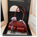 Retro brown PU leather pillow-shaped women's shoulder bag with double straps and a flap closure.