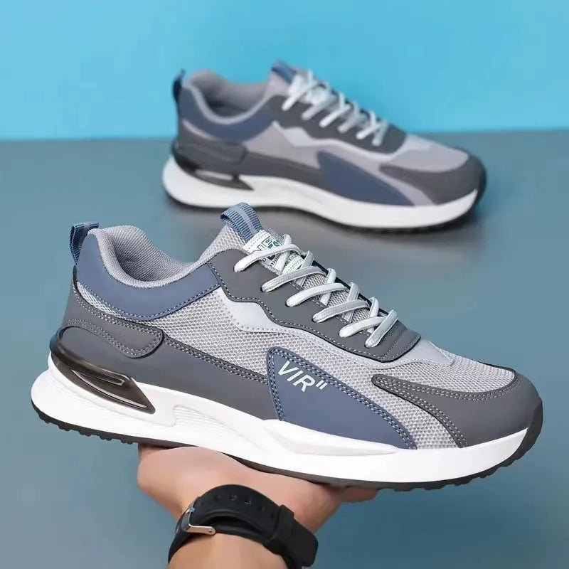Men's colour block mesh lace-up sneakers in black, grey, and white on a injection moulded sole.