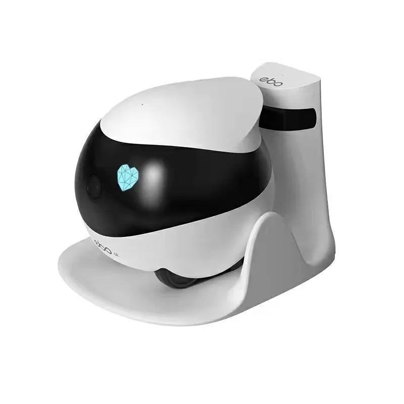 White smart home mobile surveillance robot camera on a charging dock.