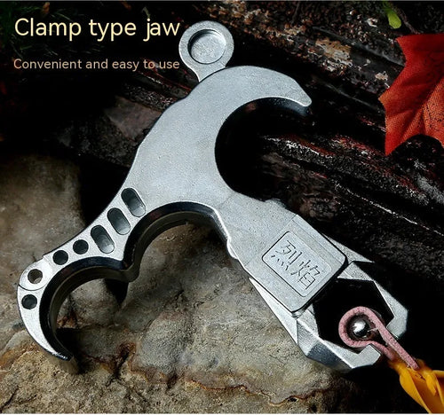 Close-up of a zinc alloy archery release aid showing its two-axis harpoon clip mechanism.