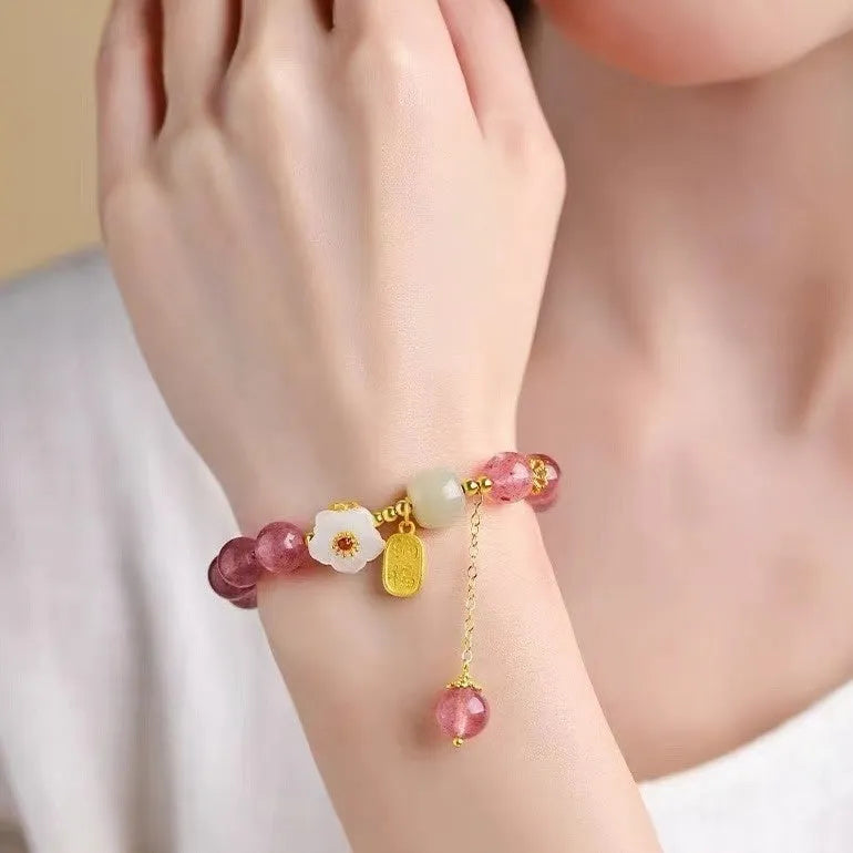 Handcrafted strawberry quartz crystal bracelet with Hetian jade peach blossom charms