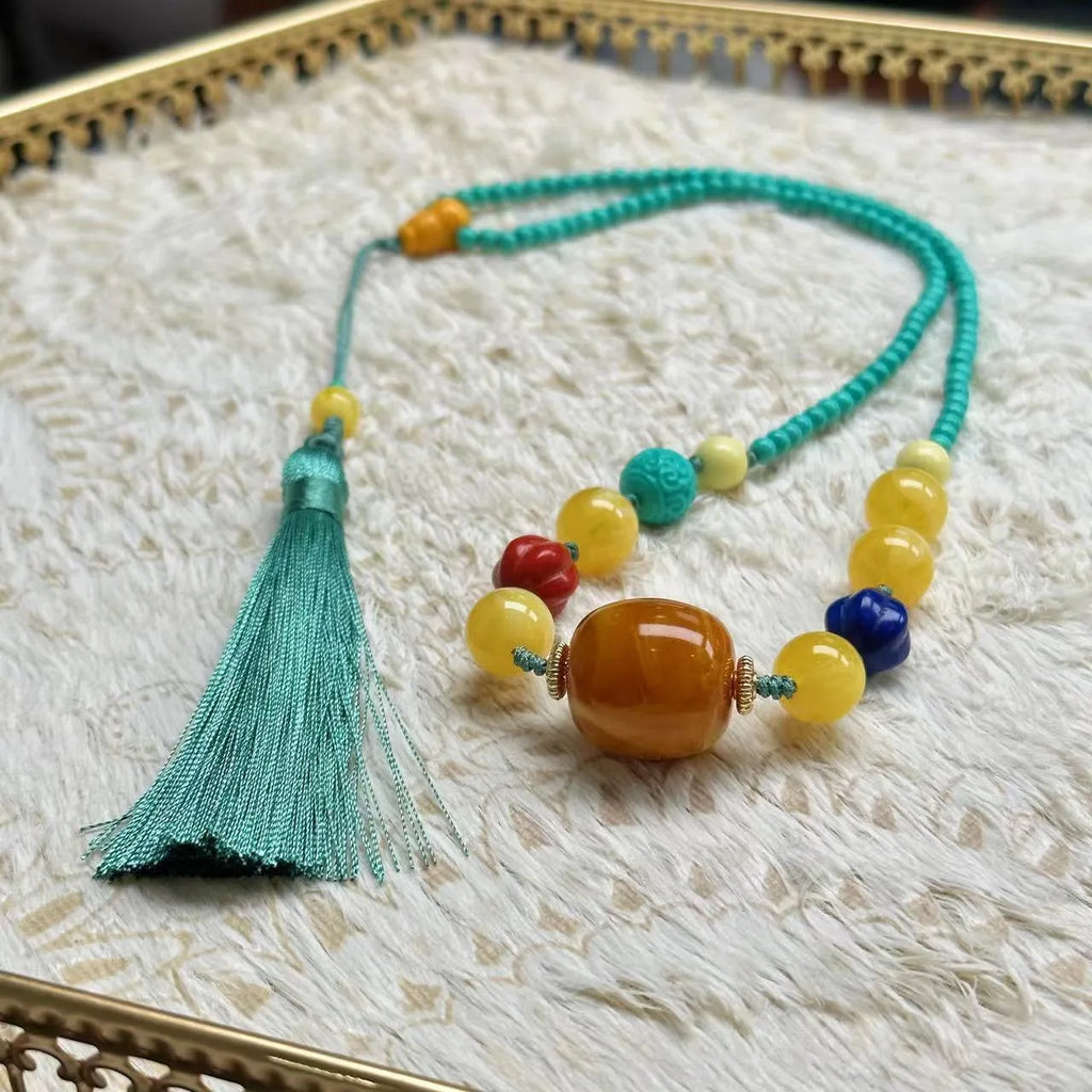Turquoise stone mesh flower lucky pendant on an adjustable ball bead necklace chain.