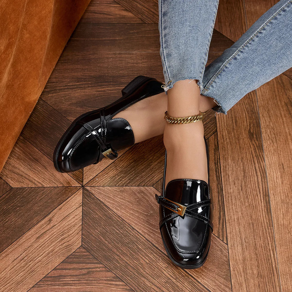 Patent leather square toe loafers in black with low heel and rubber sole