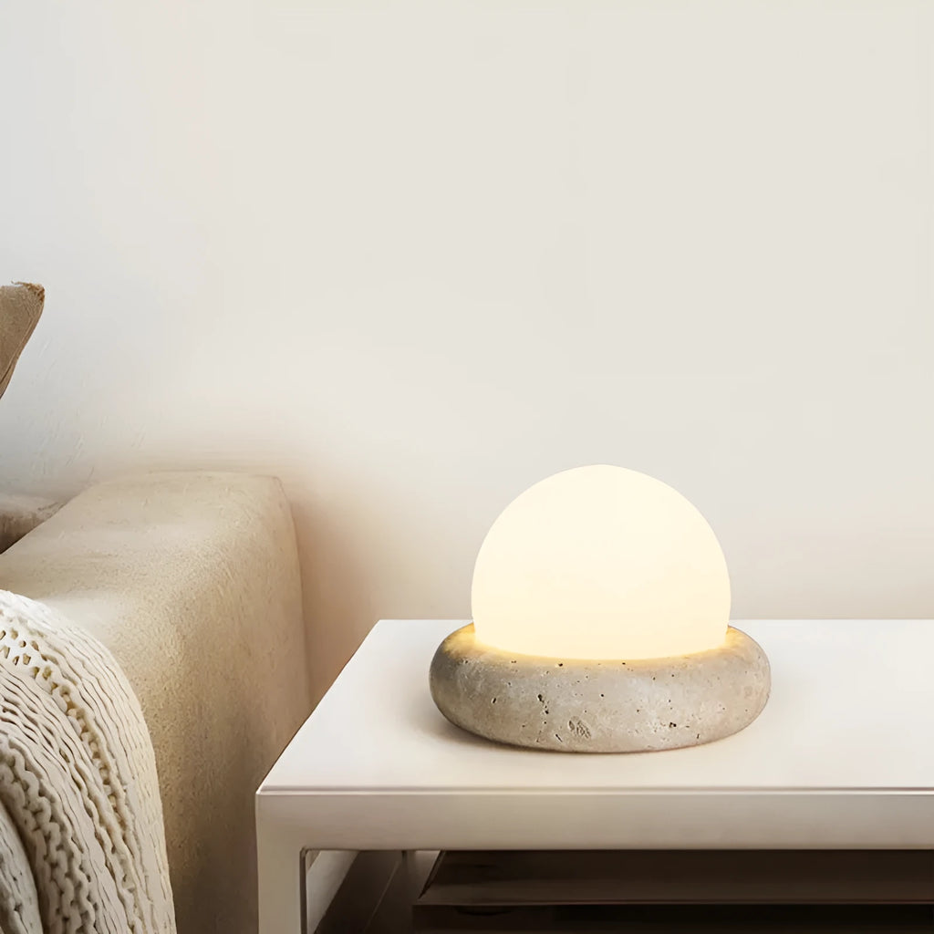 Cream style bedside night light with remote control on bedroom surface