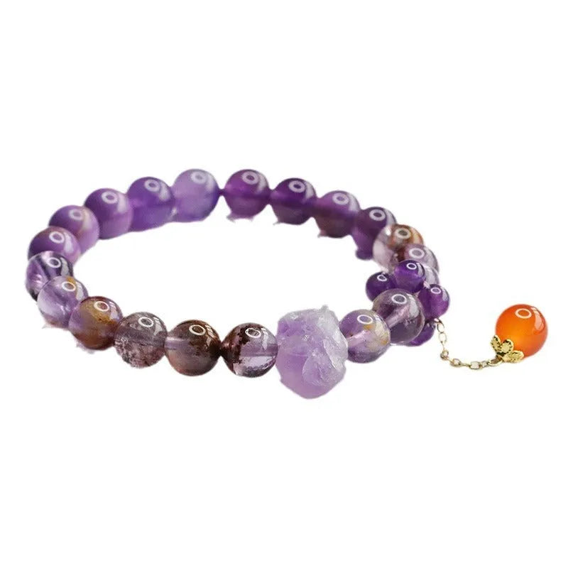 Natural Nine Purple Amethyst and red agate Mori style bracelet on wrist.