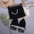 Women's handmade lace-up split swimsuit bikini in solid colours on a mannequin.