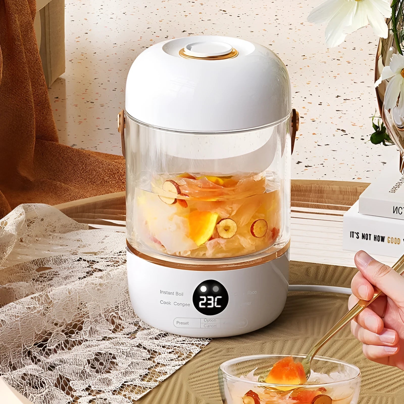 Personal smart electric stew cooker with a transparent Gaopeng glass pot on a fibreglass body.