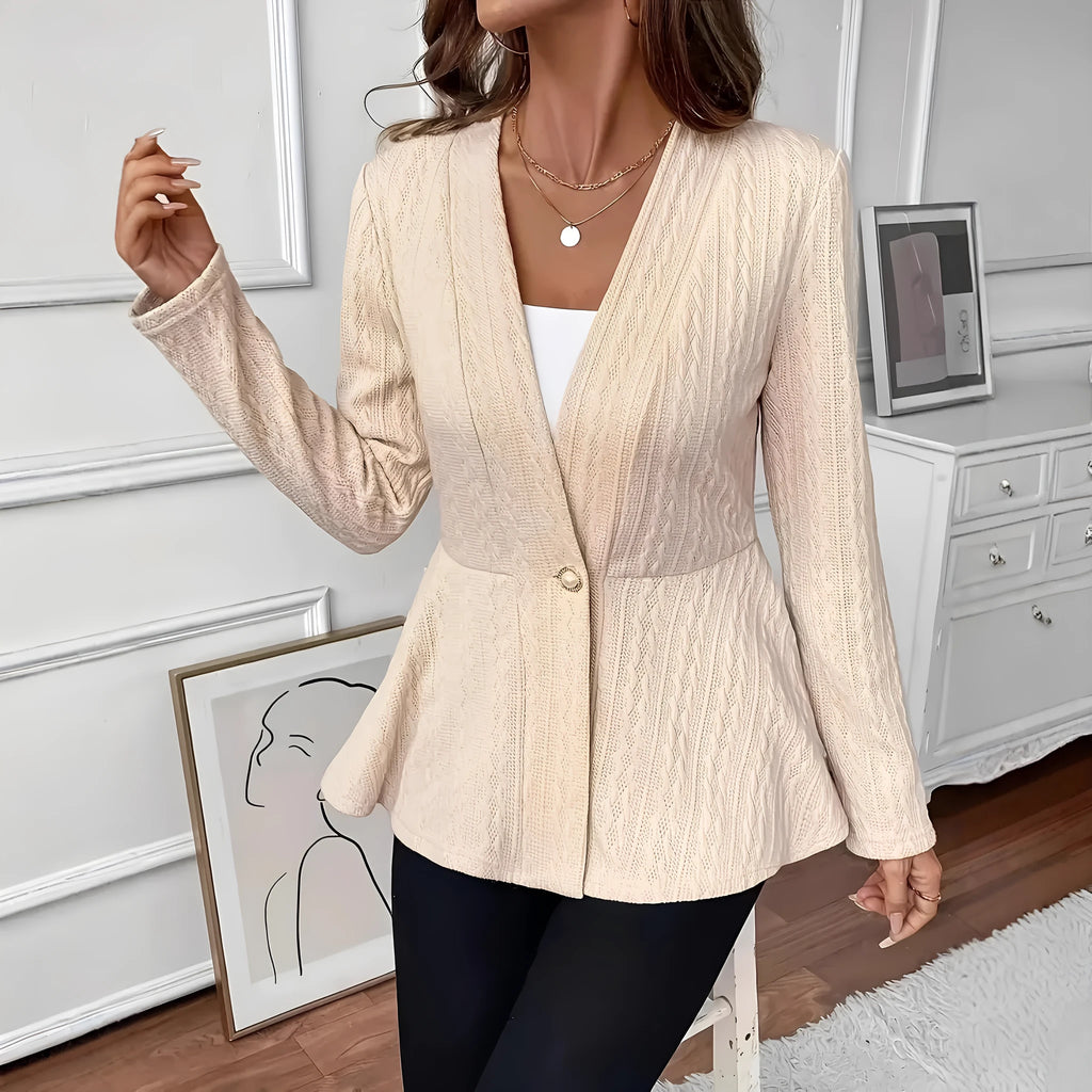 Women's apricot knitted cardigan with Jacquard pattern and one button, shown on a model.