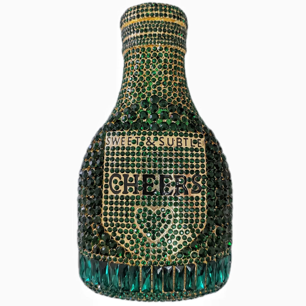 Gold champagne bottle shaped evening clutch with rhinestone decoration on black background