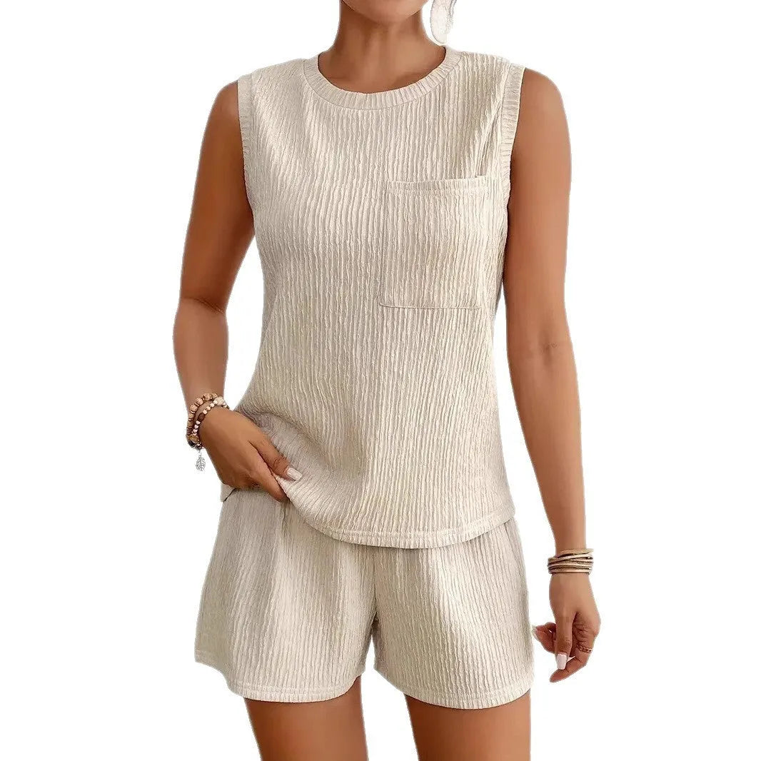 Women's apricot polyester sleeveless vest and matching shorts two-piece set on a hanger.
