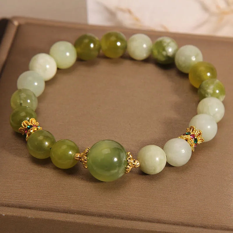 Women's Xiuyan jade bracelet in jade green with an original sweet mori style design.