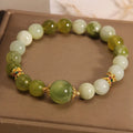Women's Xiuyan jade bracelet in jade green with an original sweet mori style design.