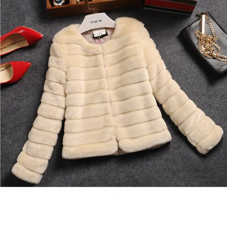 Women's cropped faux fur top in beige, shown on a model, with regular sleeves and a short length.