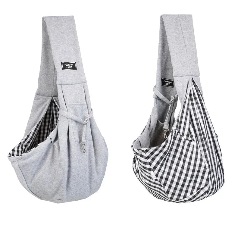 Large grey folding cat messenger backpack with mesh windows, shown on a person's back.