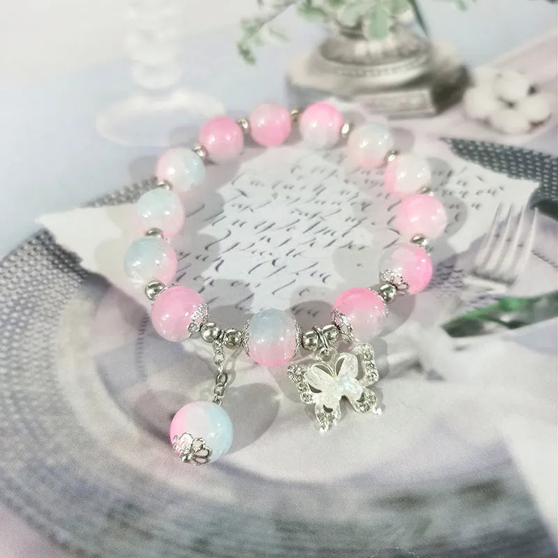 Chinese style glass bead bracelet with bamboo leaf design and manual craftsmanship details.
