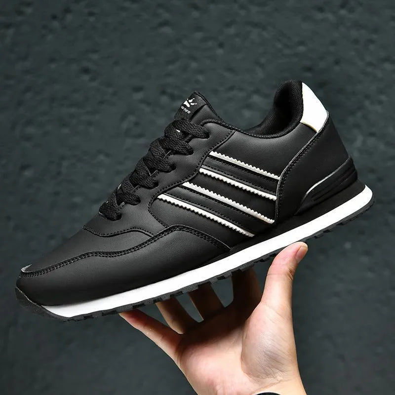 Men's casual running sports shoes with carved wing pattern in black and white space leather