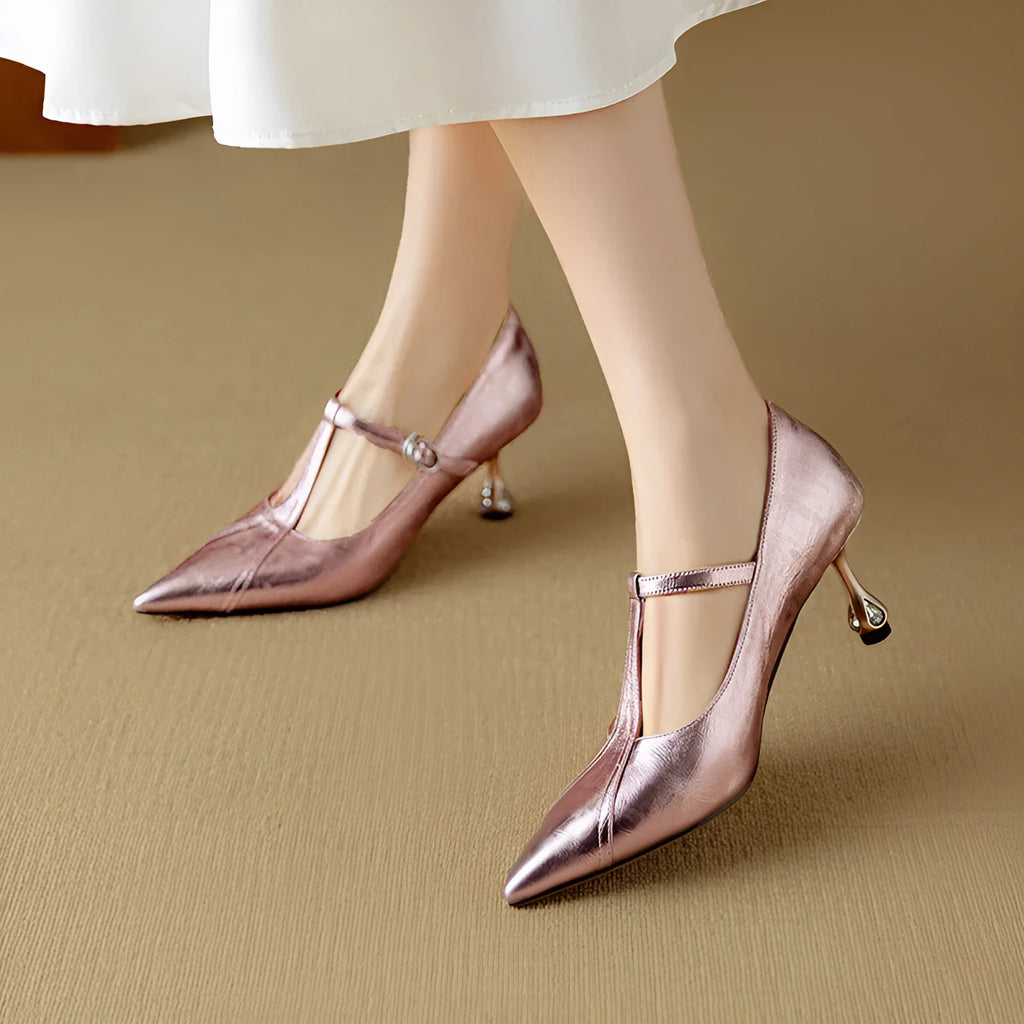 Women's gunmetal leather pointed-toe pumps with a low-cut front and chunky mid-height heel.