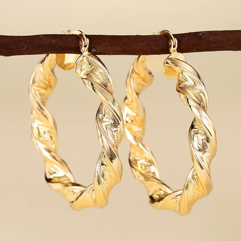 Women's geometric ring design ear clips in electroplated copper with drop-shaped modelling