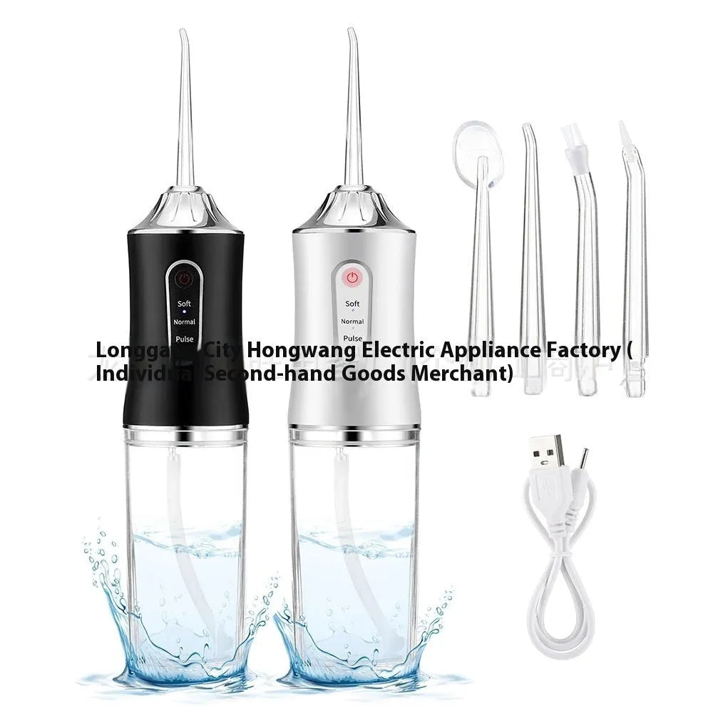 Pink electric water flosser with nozzle and water tank on a bathroom surface