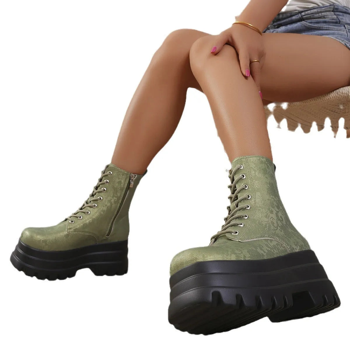 Women's black platform Martin boots with side zip and chunky rubber sole.