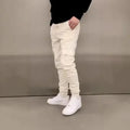 Men's light blue baggy casual polyester trousers with elastic waist and patch pockets laid flat.