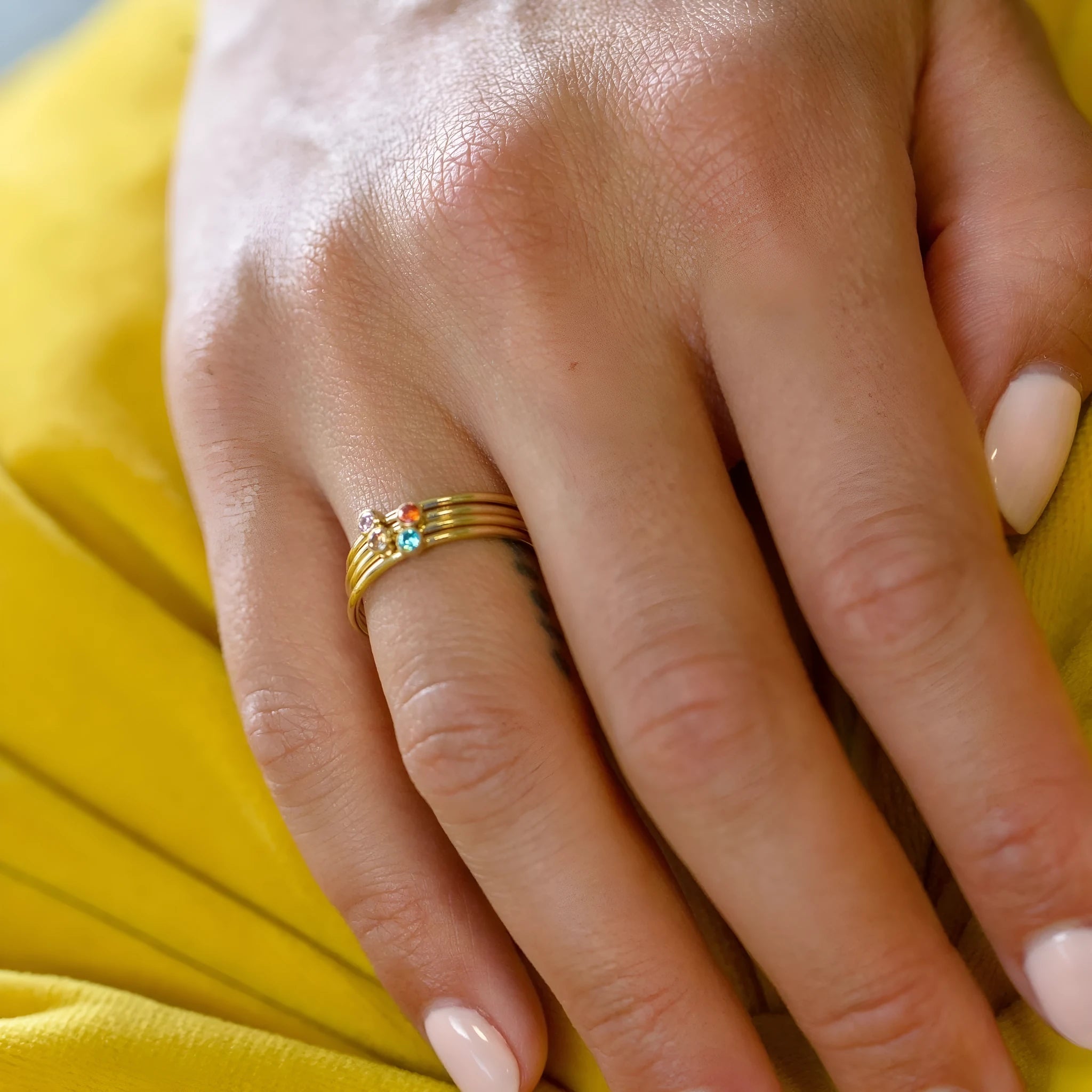 A geometric titanium steel ring engraved with a December birthstone superimposed design.
