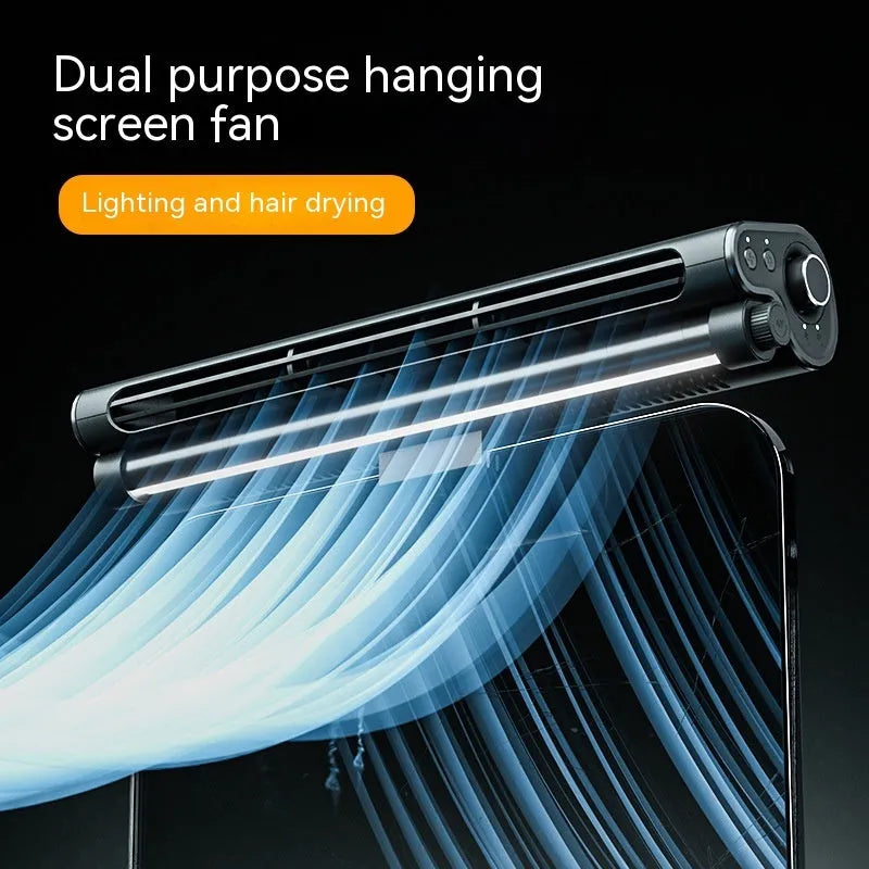 Black bladeless USB clip-on fan with integrated lamp attached to a laptop screen.
