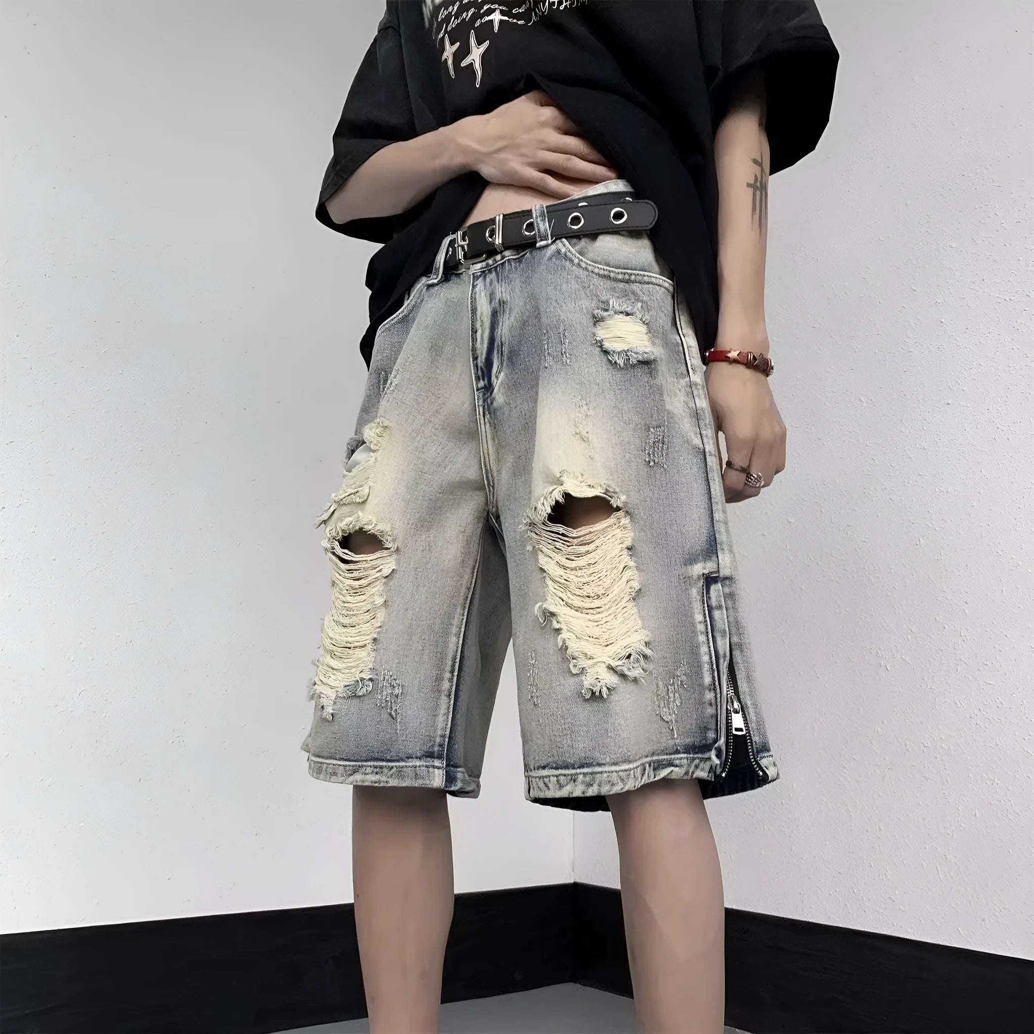 Blue retro-style denim shorts with a loose wide-leg cut and tattered detailing.