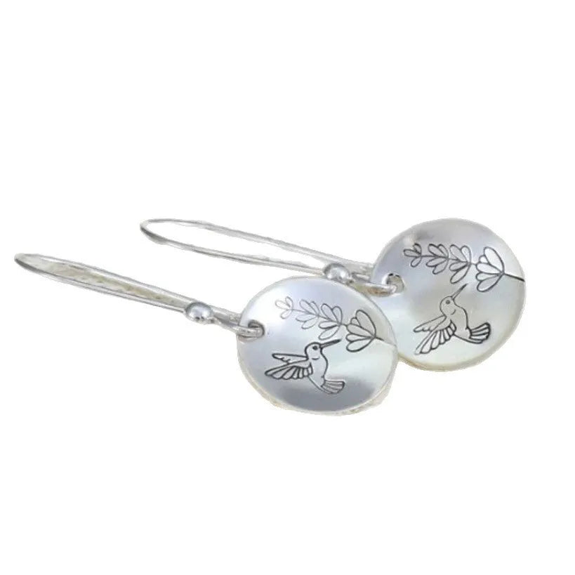 Silver zinc alloy women's earrings with glossy round bird and flower designs featuring leaf patterns