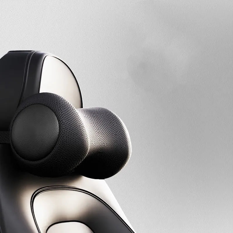 Car seat massage cushion and headrest set made from memory foam in a neutral colour.