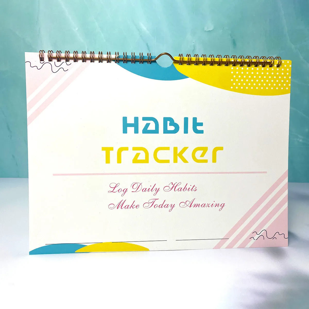 Habit tracking book with 12 pages measuring 21cm by 28cm in four colour options