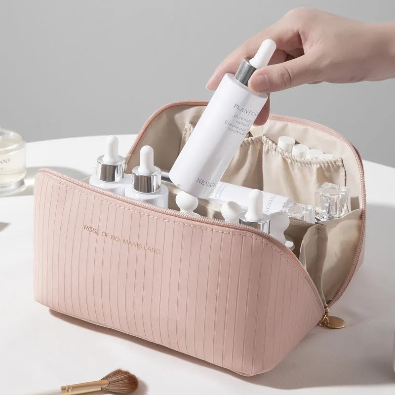 Vertical pattern cubic PU makeup bag in beige, shown with dimensions 22.5cm by 12.5cm.