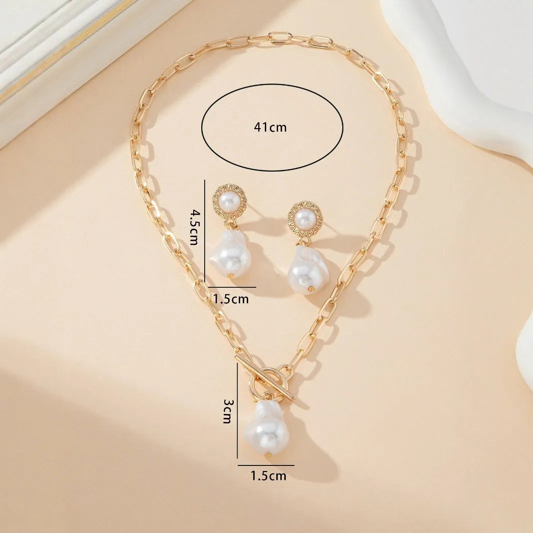 Gold tone retro baroque pearl necklace and matching ear stud set for women.