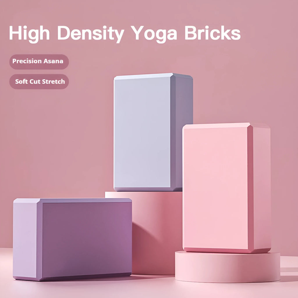 Solid colour EVA foam yoga block on a gym mat, showing its rectangular shape and ridged sides.