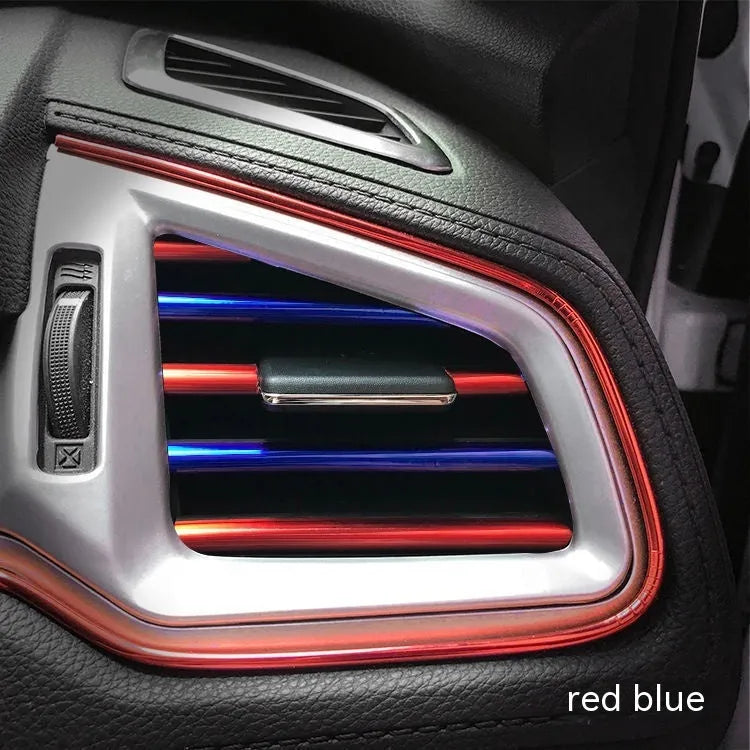 Ten PVC car air conditioning outlet trim clips in assorted colours on a dark dashboard