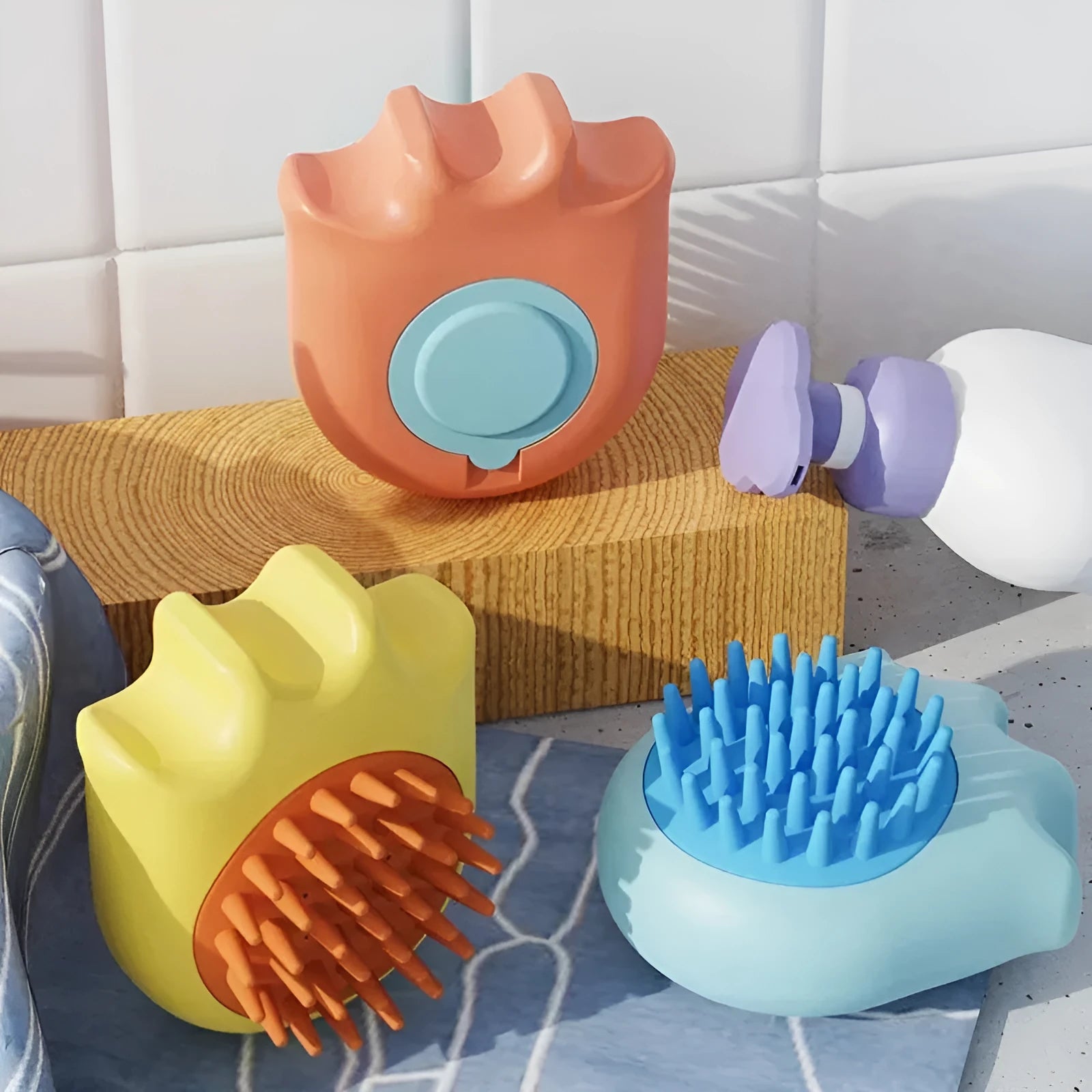 Blue pet bath brush with a massage comb head and a built-in shampoo box in the handle.