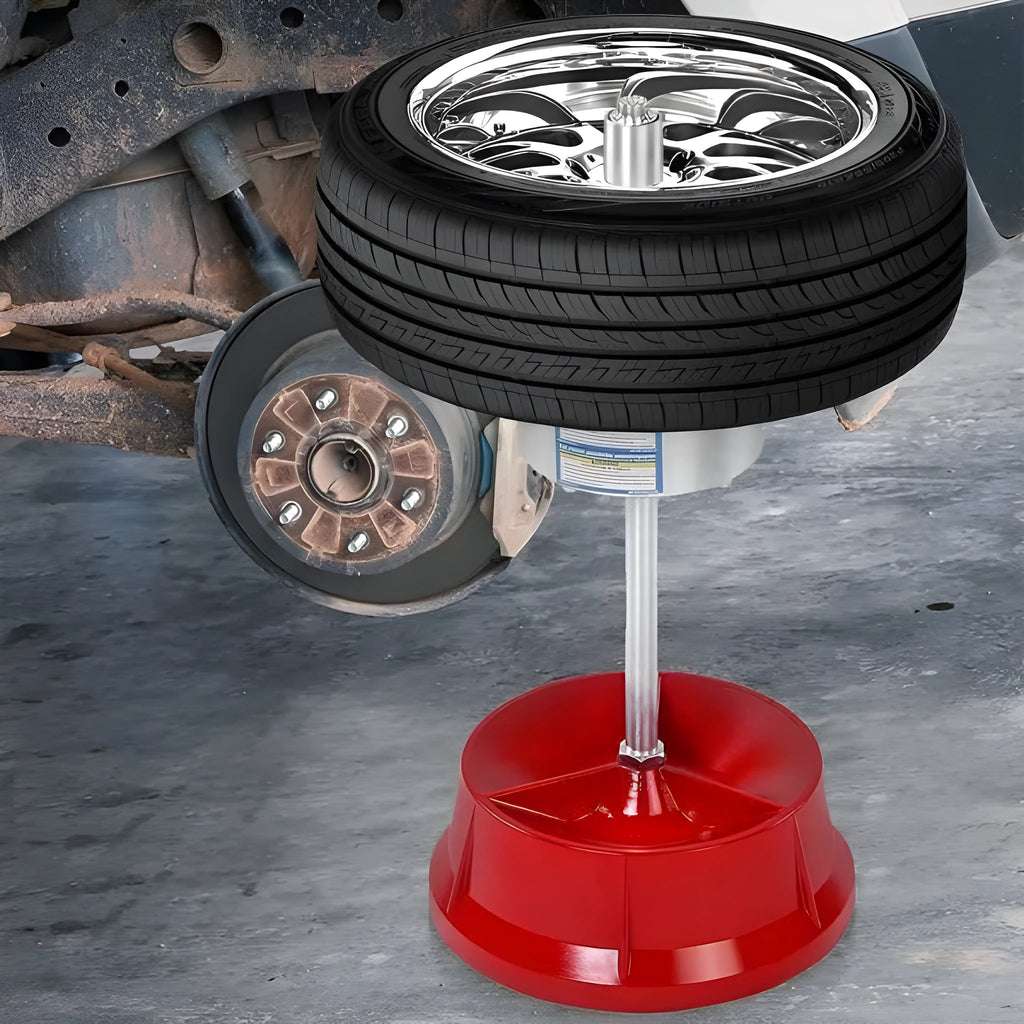 Portable hub balancer with aluminium head and enamel-finished base for balancing car and truck tyres.