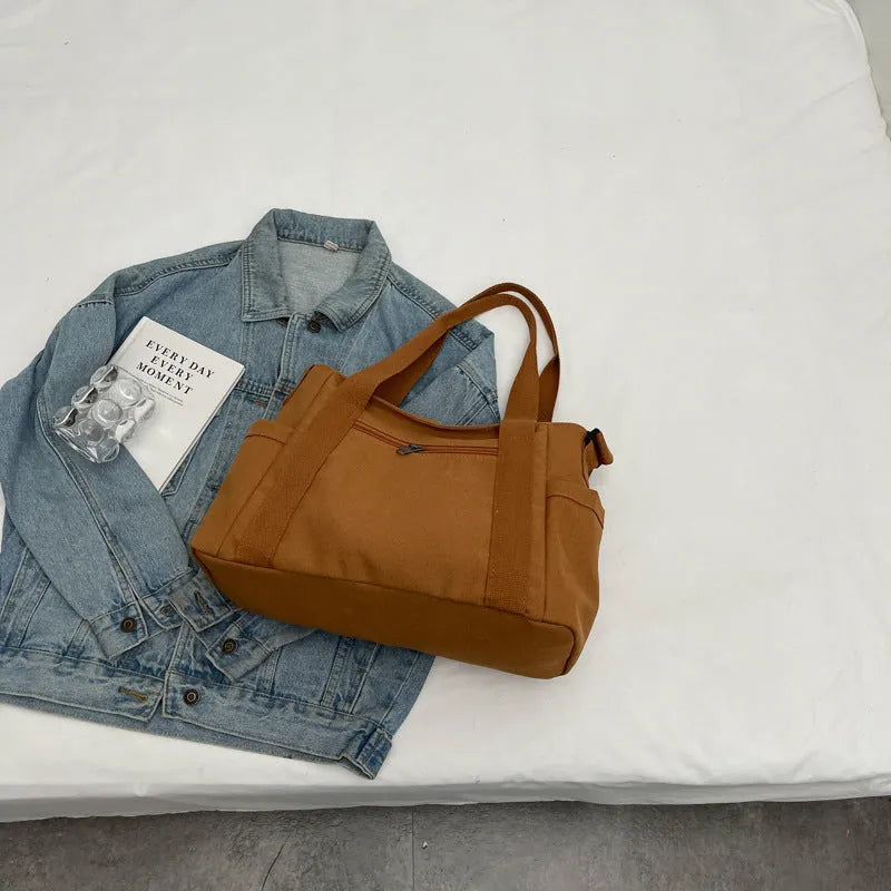 Large capacity polyester shoulder tote bag for women in solid colours with mobile phone pocket