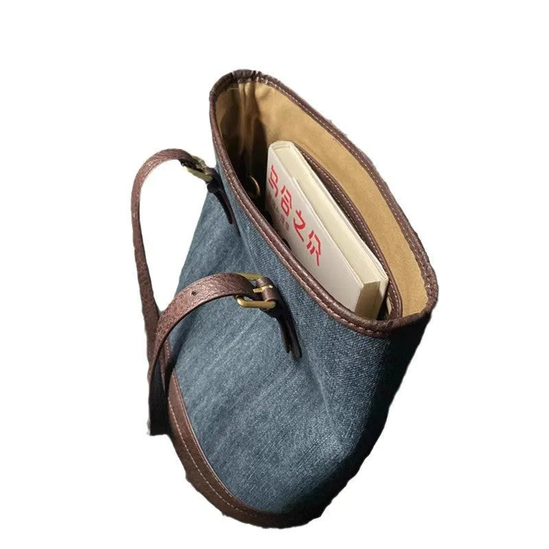 Denim patchwork bucket handbag showing patchwork detailing and one-shoulder strap