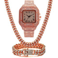 Gold Roman numeral quartz watch with diamond studs on a black mesh band, alongside a matching bracelet and necklace.