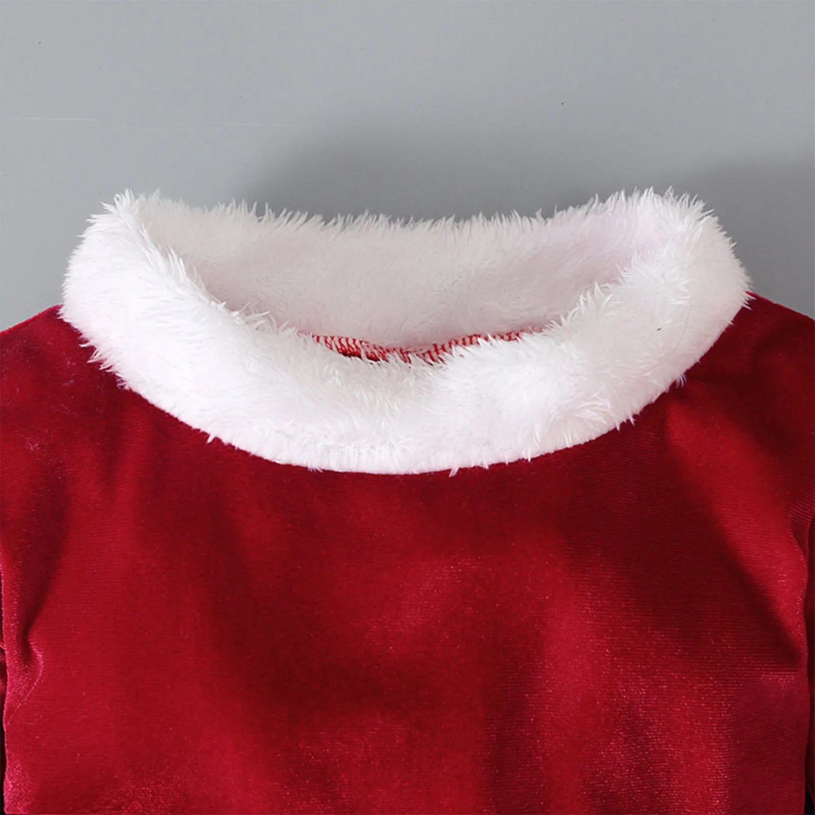 Red Korean velvet children's Christmas three-piece set with shirt, bell bottoms, and hat on display