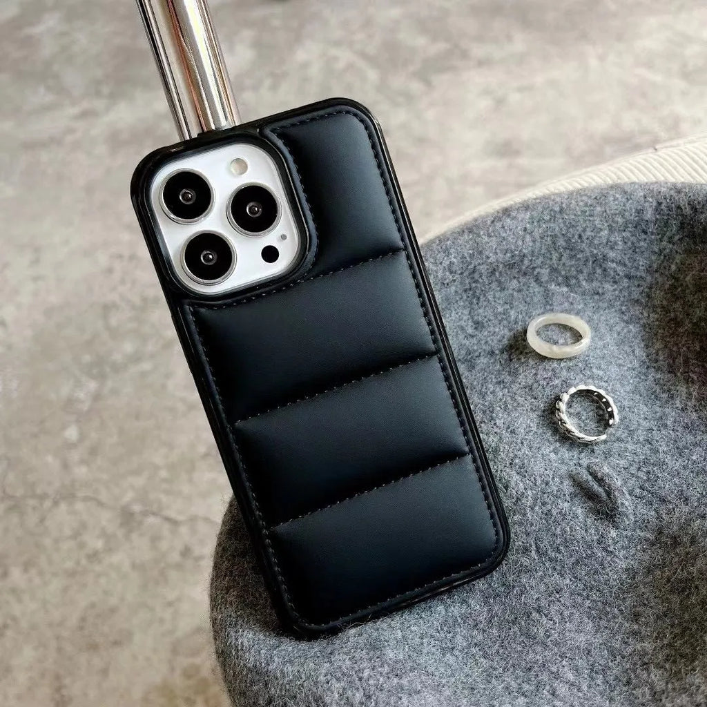 Candy down jacket phone case for iPhone 17 in black showing padded design and cut-outs