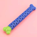 Blue green silicone dog toothbrush cleaning stick with textured surfaces and nodules for gum massage.