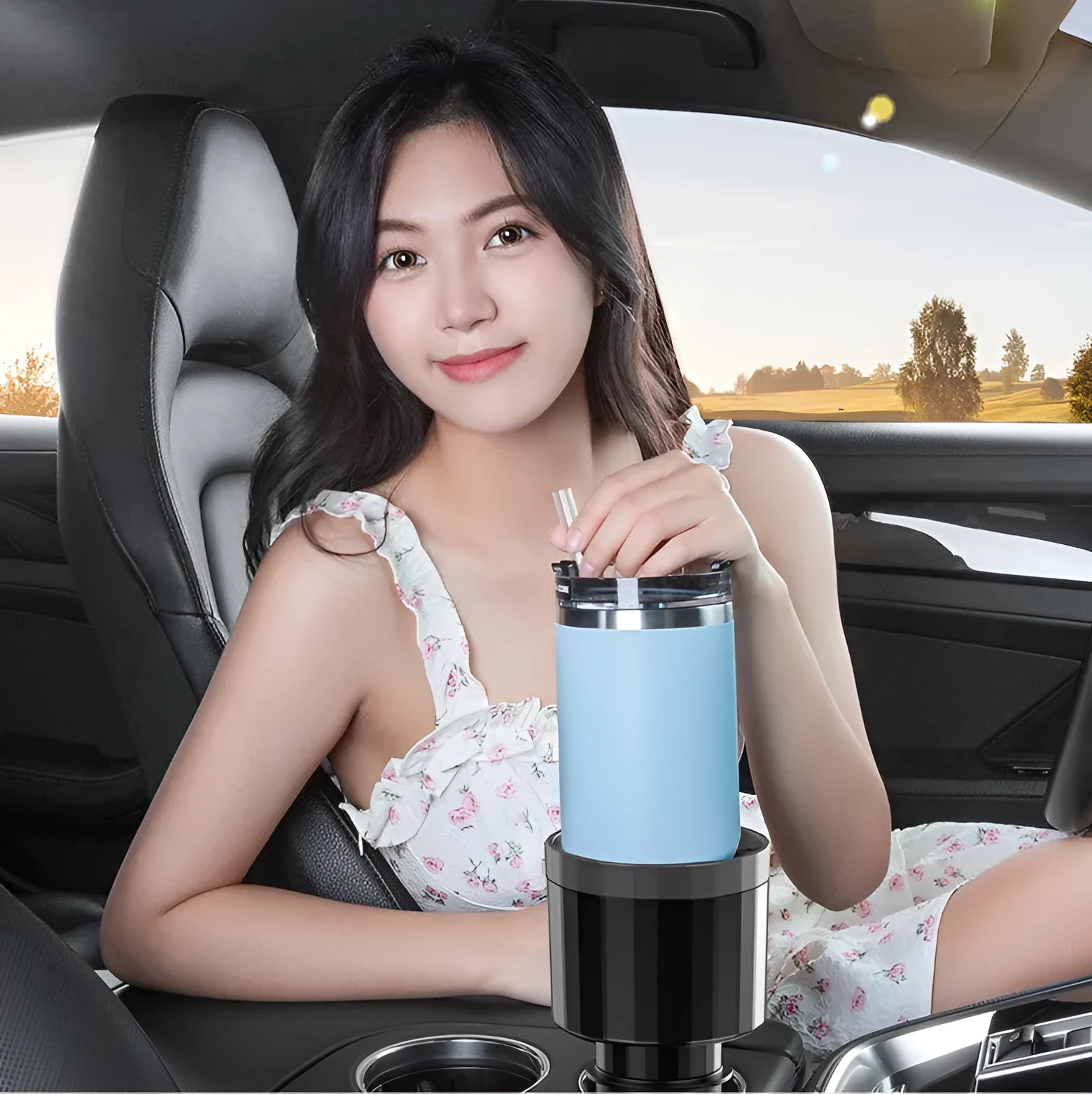 Black adjustable car cup holder expander for large drink bottles and containers.