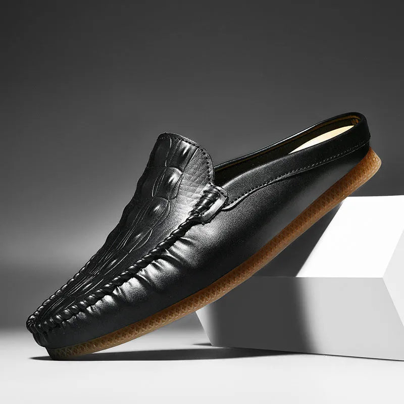 Men's black Gommino-style leisure semi-slippers with artificial PU upper and rubber sole on a white background.