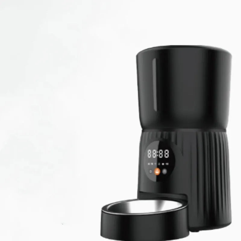 Black automatic pet feeder with digital display and food hopper on a floor