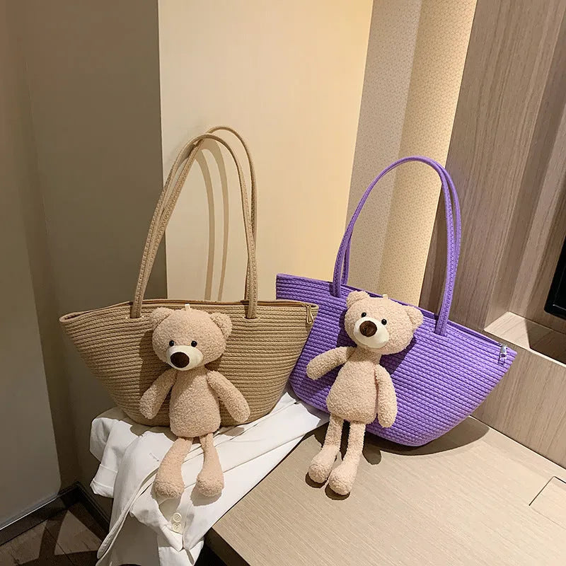 Woven cotton linen tote bag with dumpling shape, double shoulder straps, and an external pocket in one of six colours.