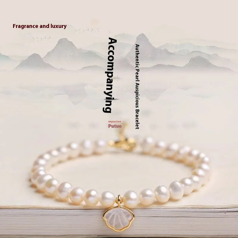 Freshwater pearl bracelet for women showing elastic and chain fastening options with fan-shaped alloy clasp
