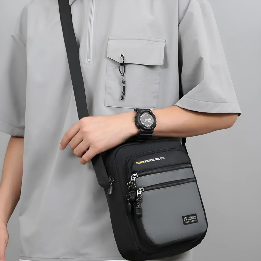 Men's waterproof nylon crossbody bag in solid colour with multiple compartments for outdoor and commuting use