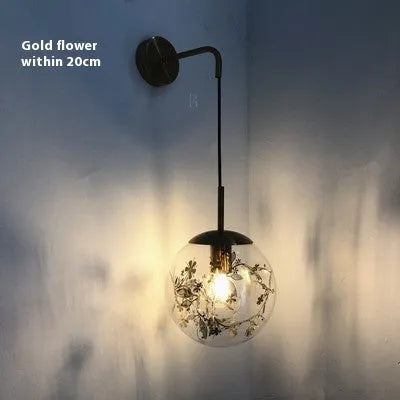 Modern simple glass wall-mounted bedside lamp in golden or silver finish.